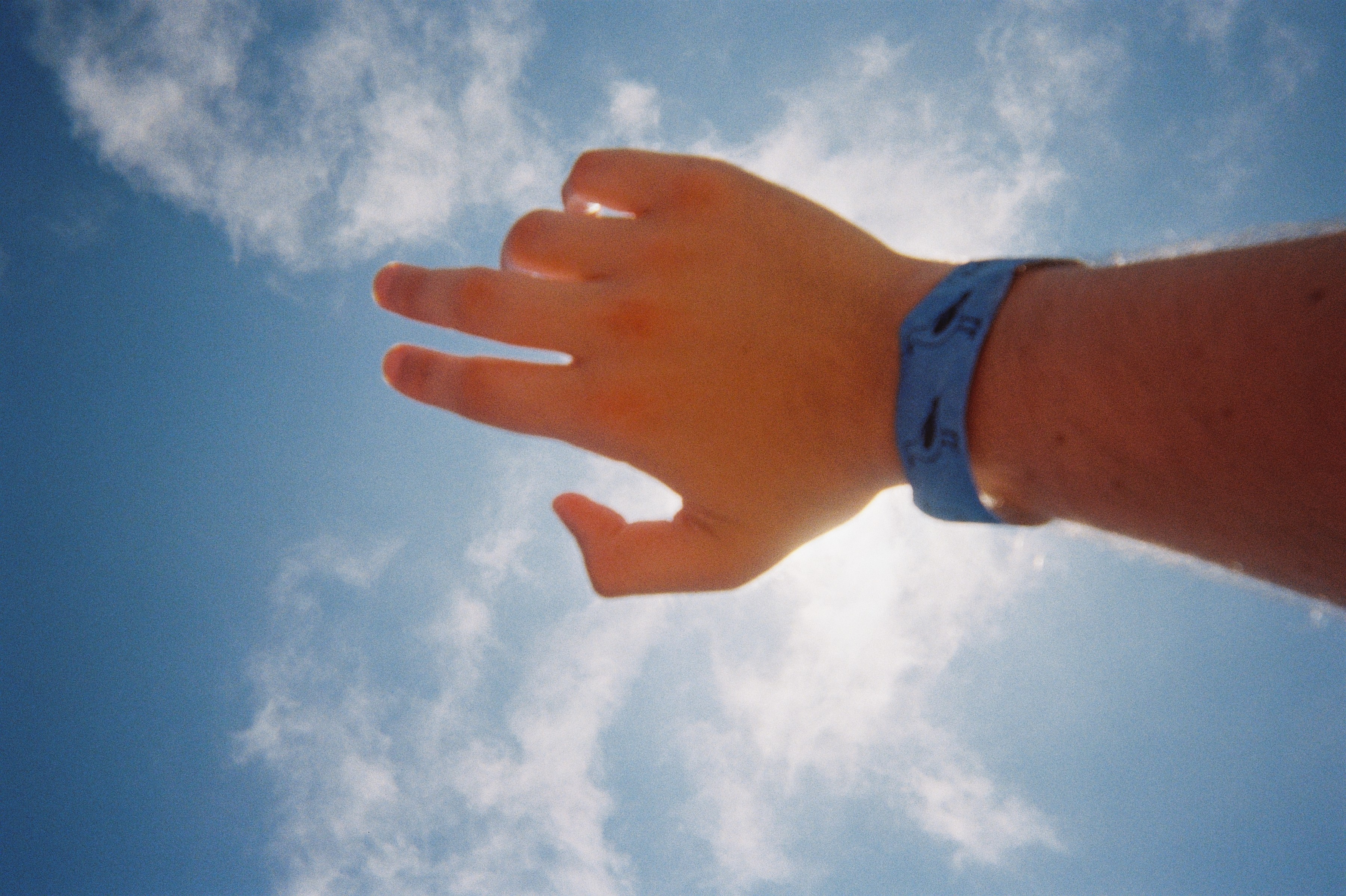 (sun behind hand, on film)